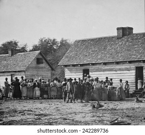 Group of slaves on J.J. Smith's plantation in Beaufort, South Carolina liberated after Union forces captured Beaufort and surrounding areas in late 1861. Photo by Timothy O'Sullivan, 1862.