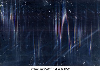 Grunge abstract background. Distressed texture. Dark blue glitched film with dust digital noise.