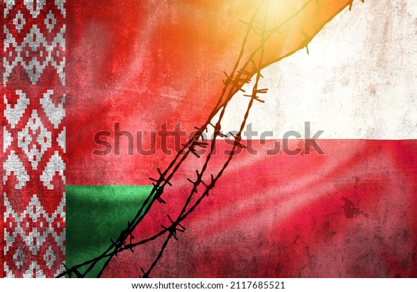 Grunge flags of Belarus and Poland divided by barb\
wire and sun haze illustration, concept of tense relations in\
migrant border\
crisis