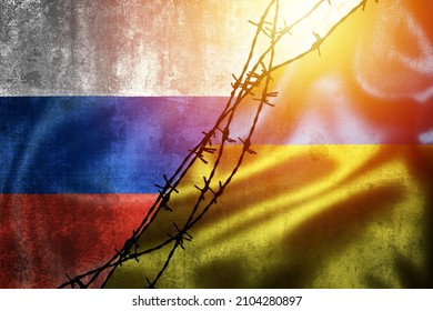 Grunge flags of Russian Federation and Ukraine divided by barb wire illustration, concept of tense relations between Ukraine and Russia