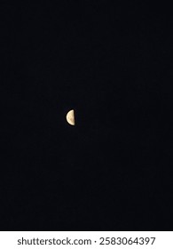 half moon in the dark sky 