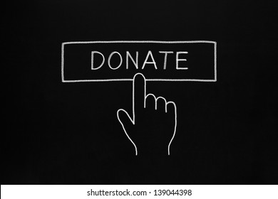 Hand clicking Donate button drawn with white chalk on blackboard.