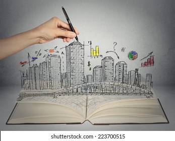 hand drawing city skyline business concept growing out of open book on grey wall background. Real estate development, house market economy, investment opportunity  - Powered by Shutterstock