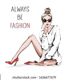 Hand drawn beautiful young woman in sunglasses with leopard print. Fashion woman. Girl with bun hairstyle. Sketch. Fashion illustration.