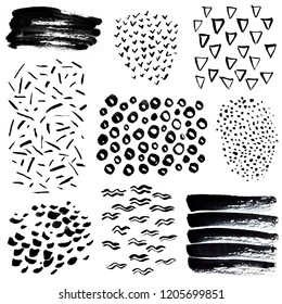 Hand drawn doodle elements isolated on white background. Brush strokes set of black dots, lines, waves, smears, triangles and strokes. Perfect for abstract compositions and background design.