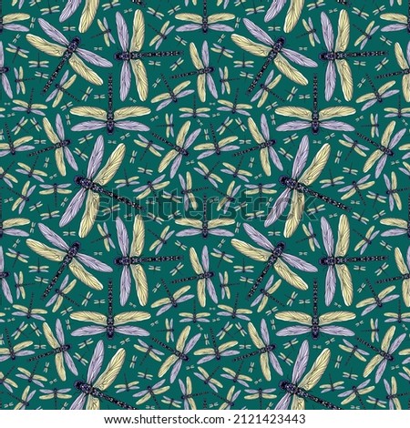 Hand drawn Dragonfly seamless pattern. Purple and yellow abstract Dragonfly on a green background.