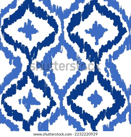 Hand drawn seamless pattern with ikat ethnic traditional indonesian fabric print. Blue indigo abstract geometric stripes lines design mid century modern splash stroke vibrant nautical print.