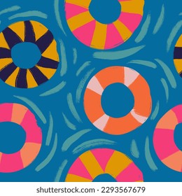 Hand drawn seamless pattern with pink yellow orange swimming rubber rings on blue water background. Float pool equipment lifebuoy lifesaver for children kids, bright vacation travel print sea ocean