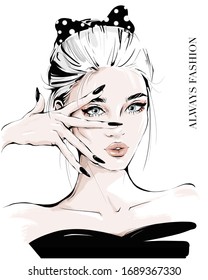 Hand drawn young woman and hand near face  Fashion girl and spotted black bow in her hair  Stylish woman  Sketch  Fashion illustration 