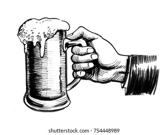 Hand holding beer mug
