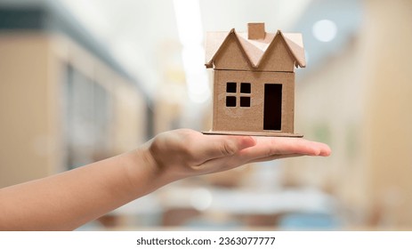 hand holding house business success - Powered by Shutterstock