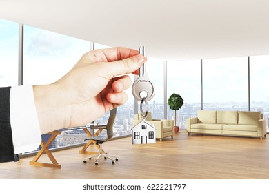 Hand holding key with house keychain in modern office interior with city view. Real estate concept. 3D Rendering - Powered by Shutterstock