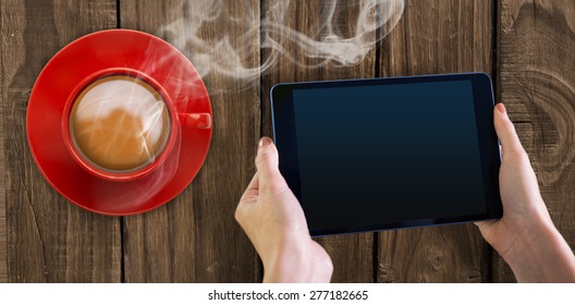 Hand holding tablet