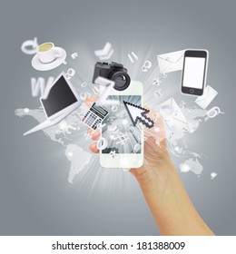 Hand holding tablet pc. Electronics are emitted from the screen tablet. The concept of electronics