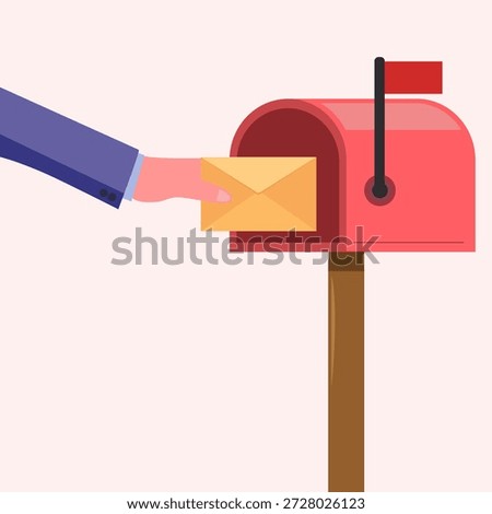 Hand holding yellow envelope inserting into mail box
