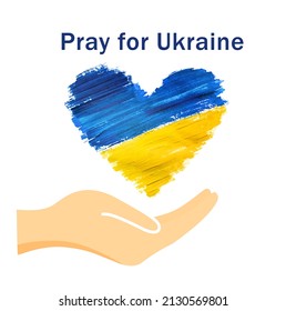 the hand supports the Ukrainian flag in the shape of a heart, the concept of peace in Ukraine, pray for Ukraine