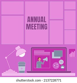 Hand writing sign Annual Meeting. Internet Concept Yearly gathering of an organization interested shareholders Laptop On A Table Beside Coffee Mug And Desk Lamp Showing Work Process. - Powered by Shutterstock