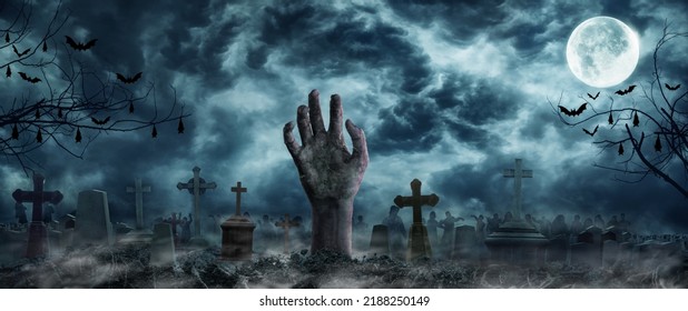 Hand Zombie Rising Out Of A Graveyard cemetery In Spooky scary dark Night full moon bats on tree. Holiday event halloween banner background concept.  - Shutterstock ID 2188250149