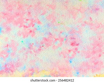 Hand-painted watercolor abstract in speckled tones of pink and blue with touches of yellow and green, for a marble-like texture.