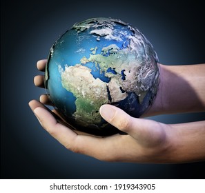 Hands holding a globe against dark background. 3D illustration.