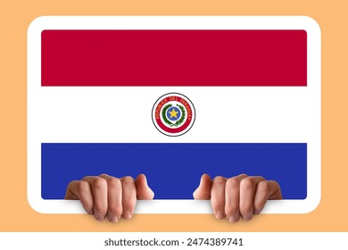 Hands holding a white frame with Paraguay flag, protest or social issues in Paraguay, independence day idea, two hands and frame, celebration or campaigning concept - Powered by Shutterstock