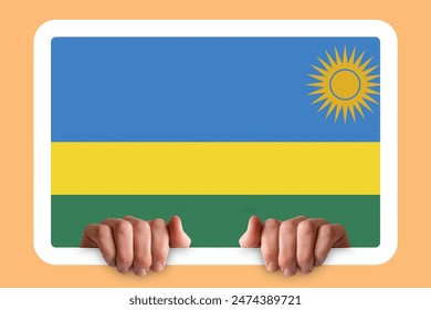 Hands holding a white frame with Rwanda flag, celebration or campaigning concept, two hands and frame, protest or social issues in Rwanda, independence day idea - Powered by Shutterstock