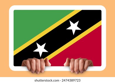 Hands holding a white frame with Saint Kitts And Nevis flag, protest or social issues in Saint Kitts And Nevis, independence day idea, two hands and frame, celebration or campaigning concept - Powered by Shutterstock