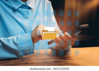 Hands Using Smartphone for Digital File Management in Modern Workspace with Abstract Folder Graphics, Business concept - Powered by Shutterstock - Get 15% off with code: PIKWIZARD15