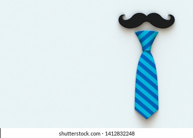 Happy Father’s Day Concept With Mustache And Neck Tie On White Background, Top View With Copy Space, 3d Rendering