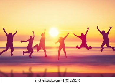 Happy friend jumping at tropical sunset beach background. Copy space of friendship freedom vacation and travel holiday teamwork concept. Vintage tone filter effect color style. - Powered by Shutterstock