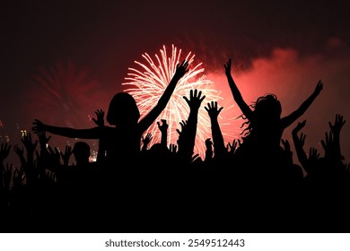 Happy people partying at New Year's or a concert - Powered by Shutterstock