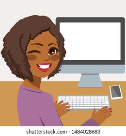 Happy Young African American Woman Using Desktop Computer