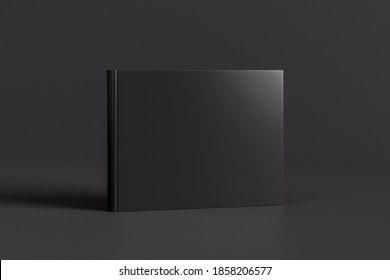 Hardcover Horizontal Or Landscape Black Mockup Book Standing On The Black Background. 3d Illustration