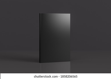 Hardcover Vertical Black Mockup Book Standing On The Black Background. 3d Illustration