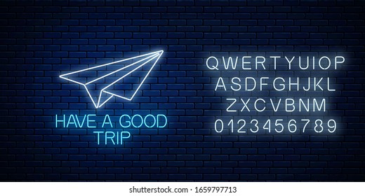 Have a good trip glowing neon banner with paper airplane sign and alphabet on dark brick wall background. Bon voyage wish banner.  illustration. - Powered by Shutterstock