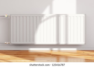 Heating system attached to wall frontal with hardwood floor