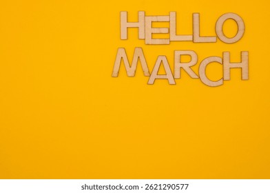 hello march write on yellow background - Powered by Shutterstock - Get 15% off with code: PIKWIZARD15