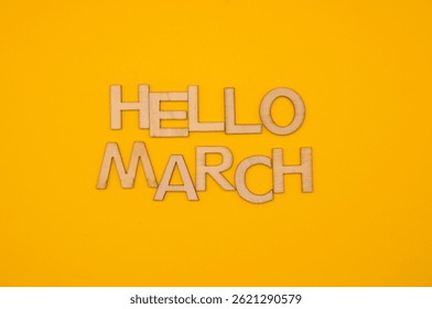hello march write on yellow background 