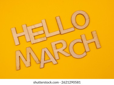 hello march write on yellow background