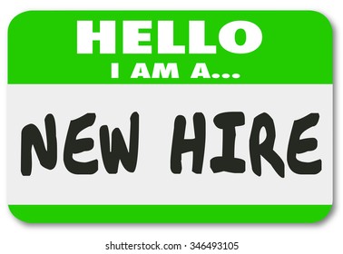 Hello I Am a New Hire words written on a green nametag sticker for a rookie employee or fresh talent just added to the team - Powered by Shutterstock