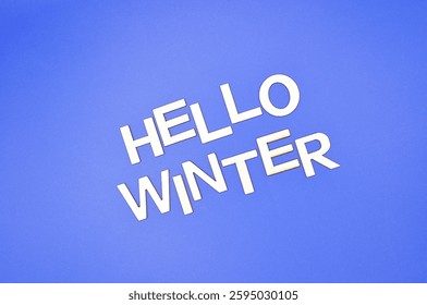 hello winter write on blue background 
