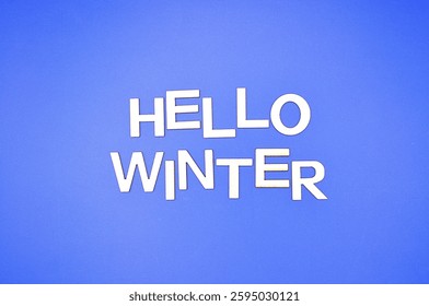 hello winter write on blue background 
