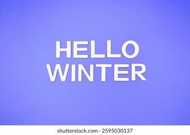 hello winter write on blue background 