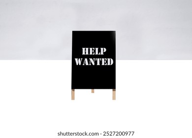 HELP WANTED. A-Frame Sign. Sidewalk chalk board. Advertising sign. Old Black Chalk board. Store signage. Black board advertising sign. Common Sayings. Good Advice. Now Hiring. Help Wanted. Work Here.  - Powered by Shutterstock