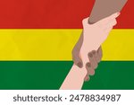Helping hand against the Bolivia flag. The concept of support. Two hands taking each other. A helping hand for those injured in the fighting, lend a hand