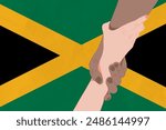 Helping hand against the Jamaica flag. The concept of support. Two hands taking each other. A helping hand for those injured in the fighting, lend a hand