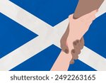 Helping hand against the Scotland flag. The concept of support. Two hands taking each other. A helping hand for those injured in the fighting, lend a hand