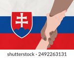 Helping hand against the Slovakia flag. The concept of support. Two hands taking each other. A helping hand for those injured in the fighting, lend a hand
