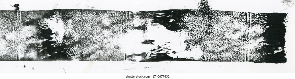 high res scan of black lino ink remain, linocutting paint roller texture on white paper background.