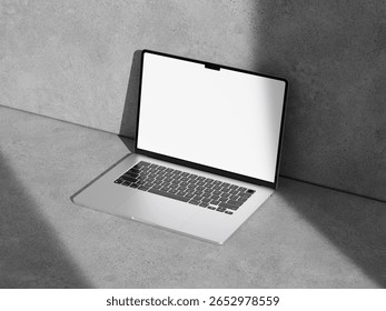 High-angle view of a laptop mockup placed on a textured cement surface, emphasizing simplicity and modernity.